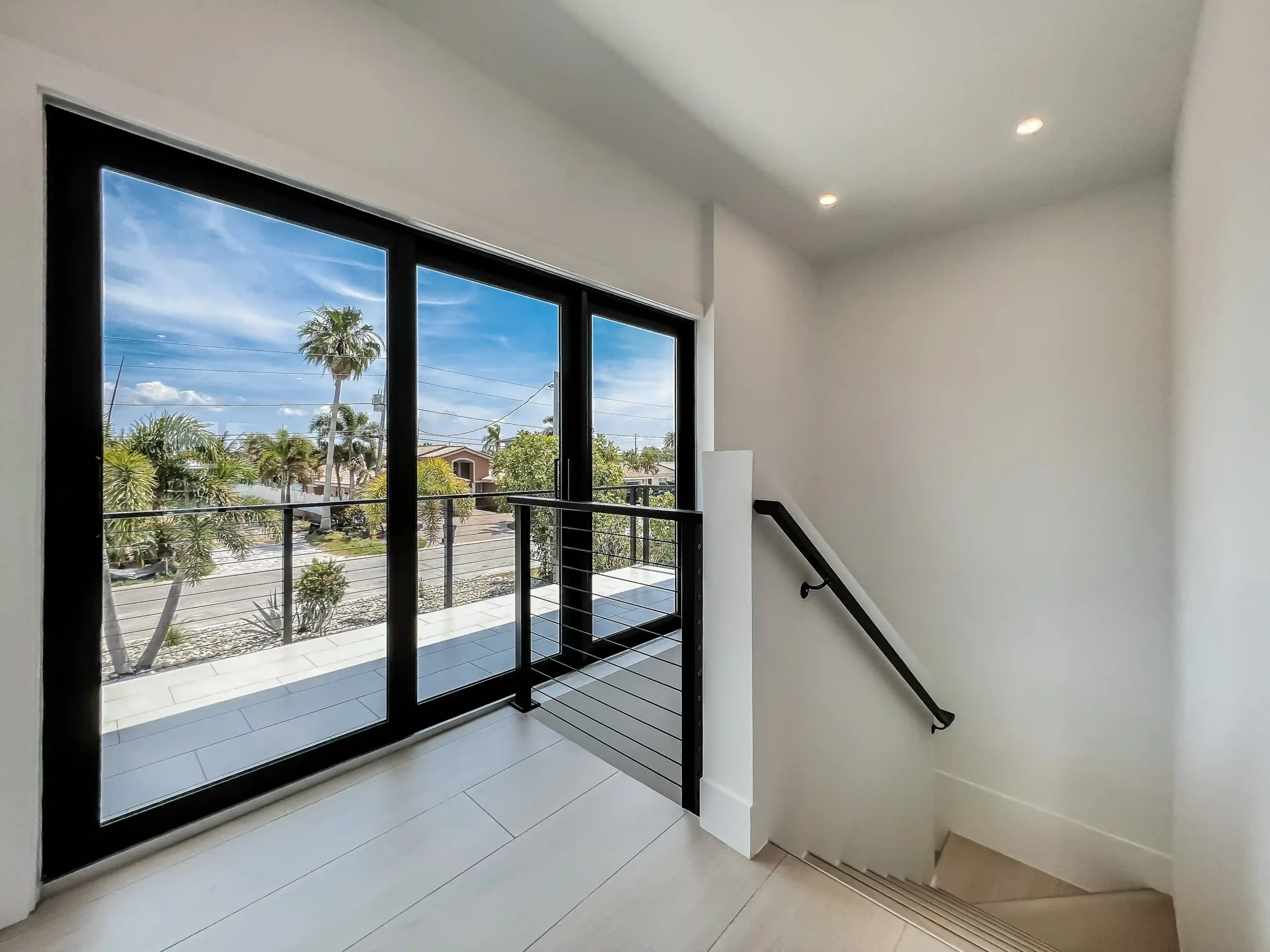 inside the house of black cable railing